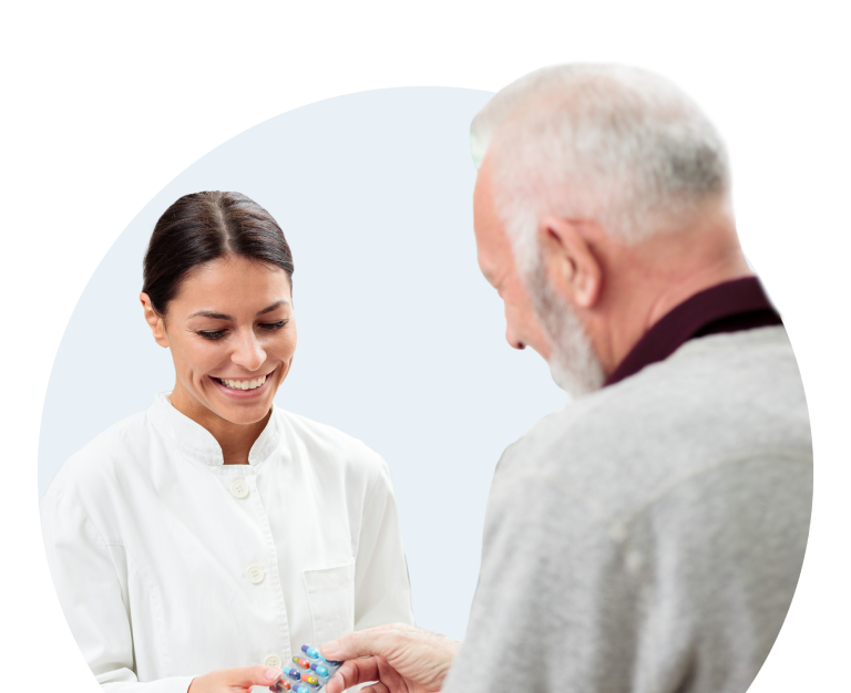 A pharmacist presenting medication to a patient.