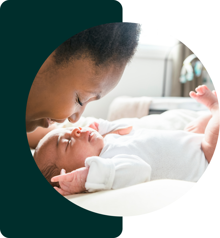 A woman embracing her newborn.