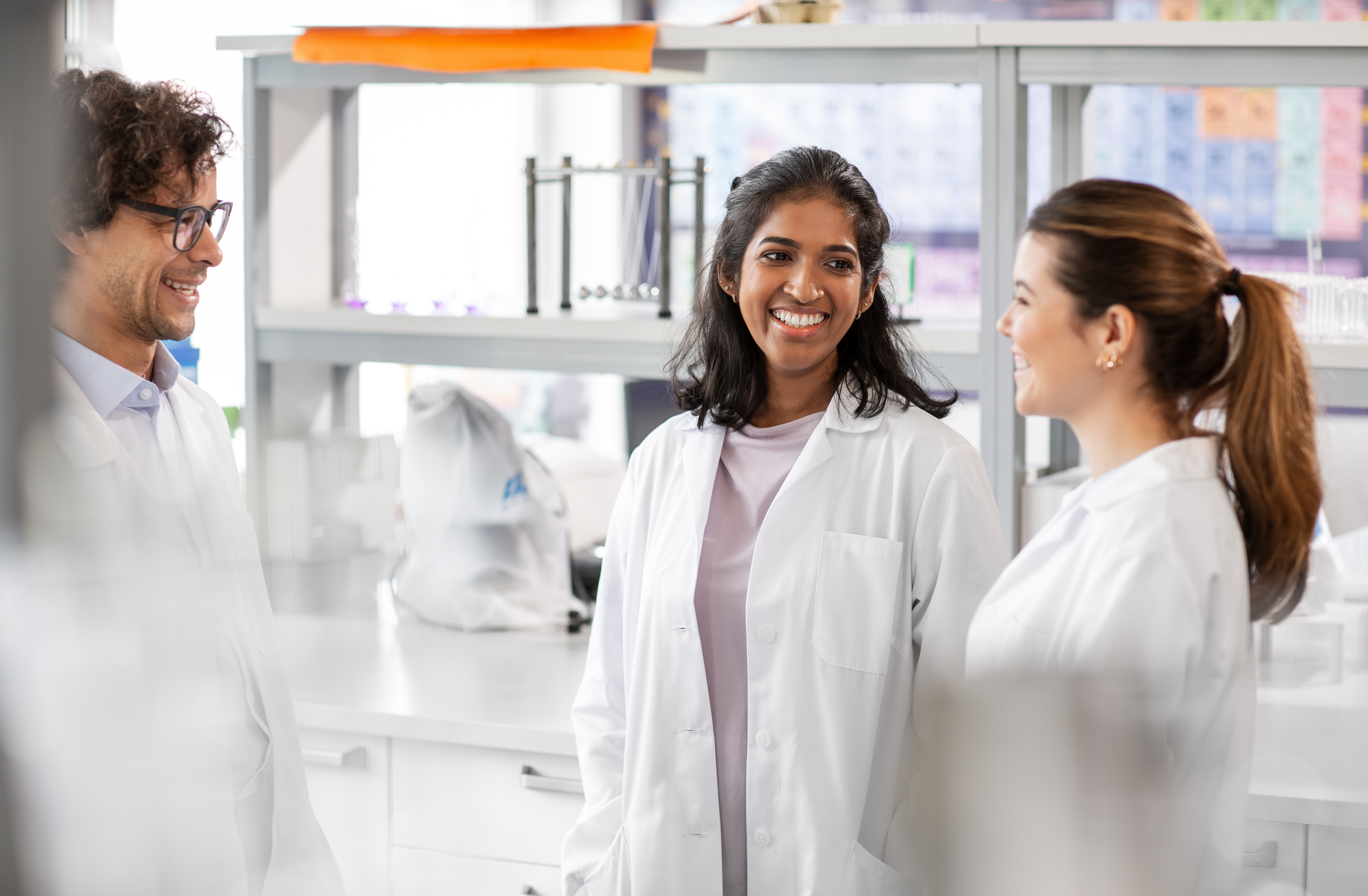 Three technicians in a laboratory.